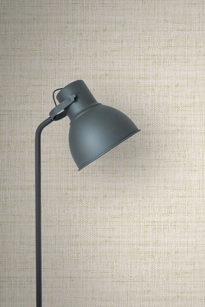 Dark gray wall lamp against a textured wall decorated with Ivory Linen Fabric Commercial & Vinyl.
