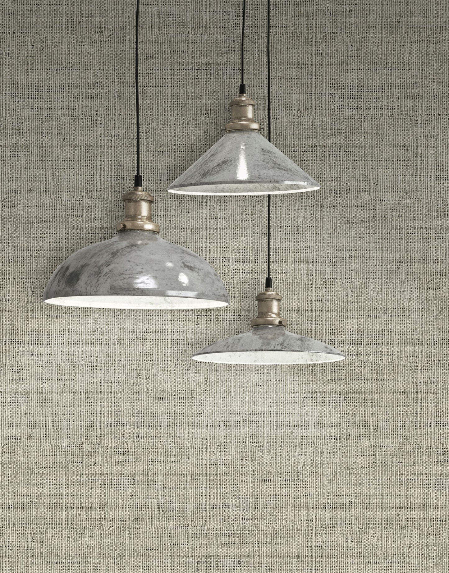 Three industrial-style pendant lights hanging against a wall decorated with Gray Linen Fabric Commercial & Vinyl.

