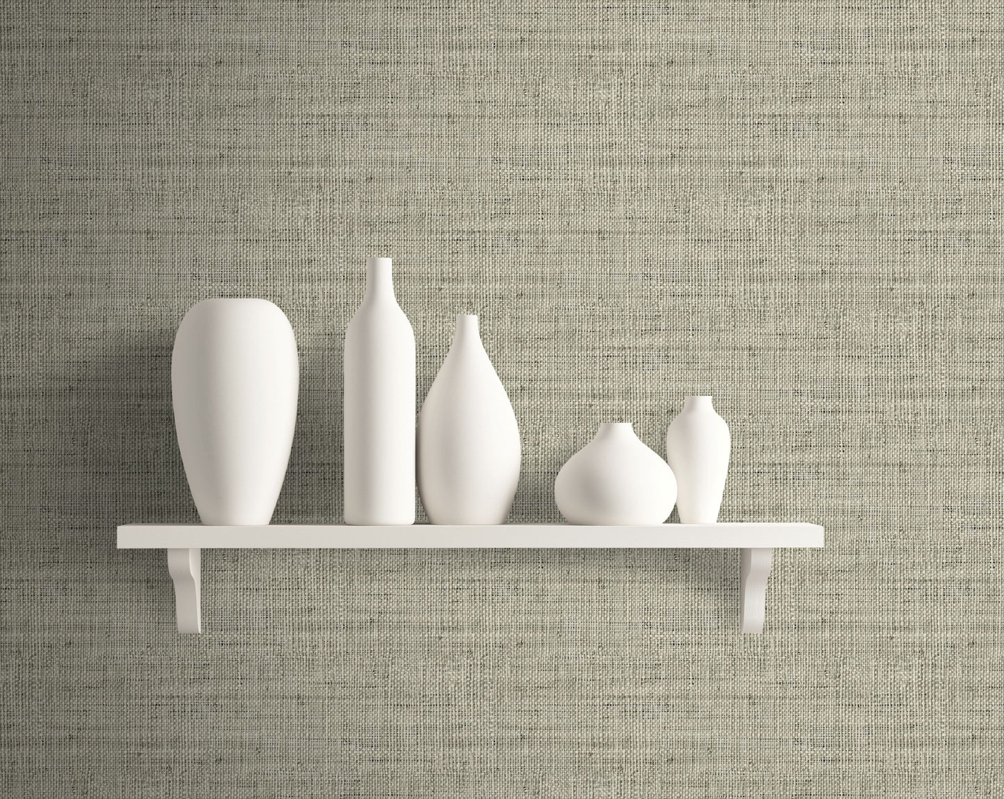 Set of white vases on a white shelf against a wall decorated with Gray Linen Fabric Commercial & Vinyl.
