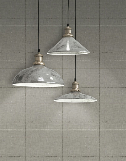 Three industrial-style pendant lights hanging against a wall decorated with Ah Gray Plaid Texture Commercial & Vinyl.
