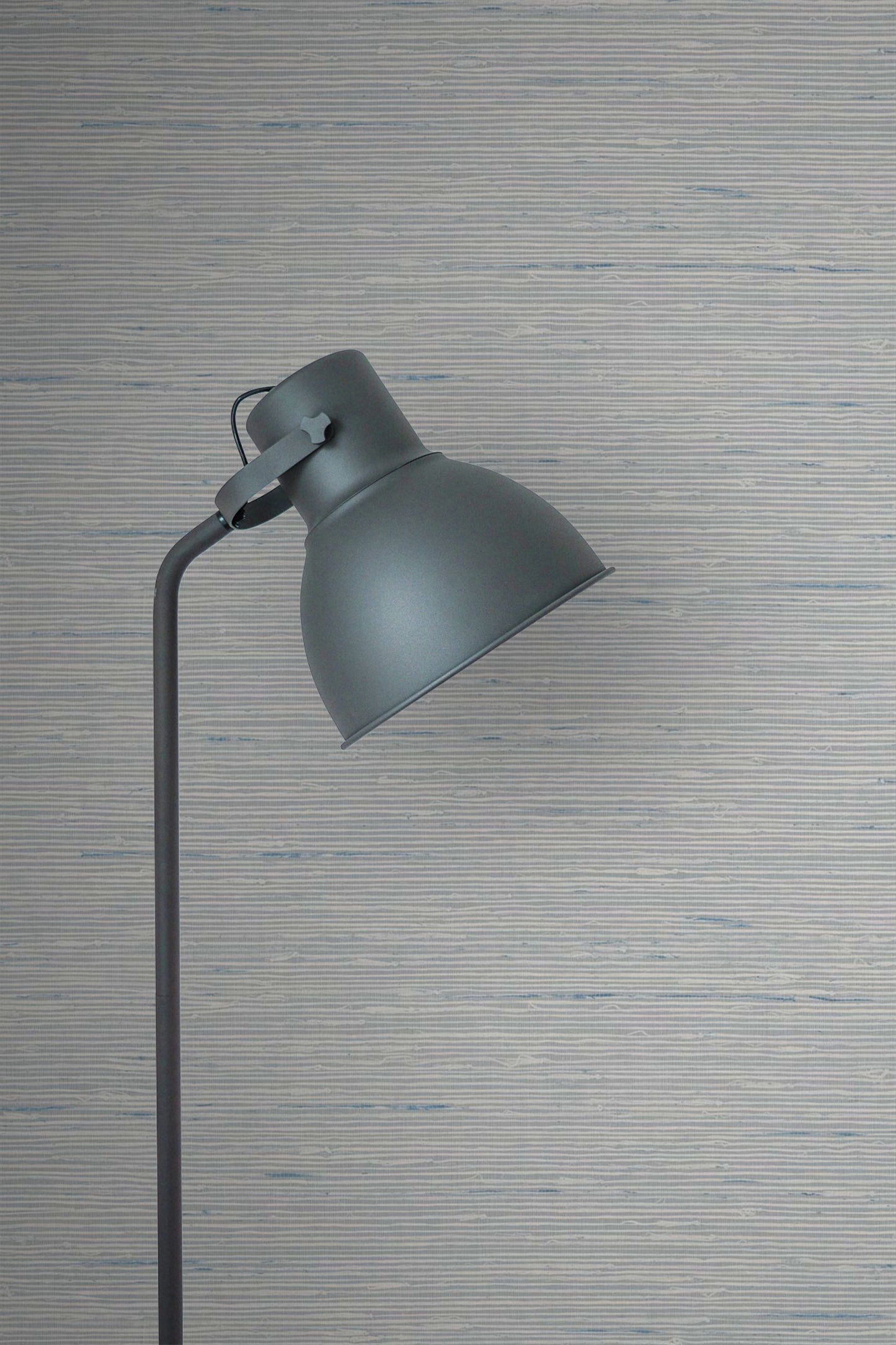 Gray floor lamp against a Silver Natural Weave Commercial & Vinyl.
