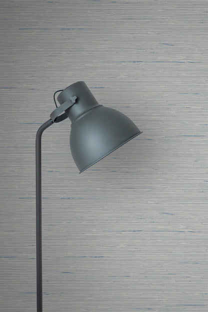 Gray floor lamp against a Silver Natural Weave Commercial & Vinyl.
