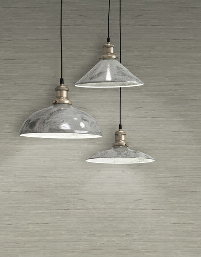 Three pendant lights with glass shades hanging against a wall decorated with Mist Gray Natural Weave Commercial & Vinyl.
