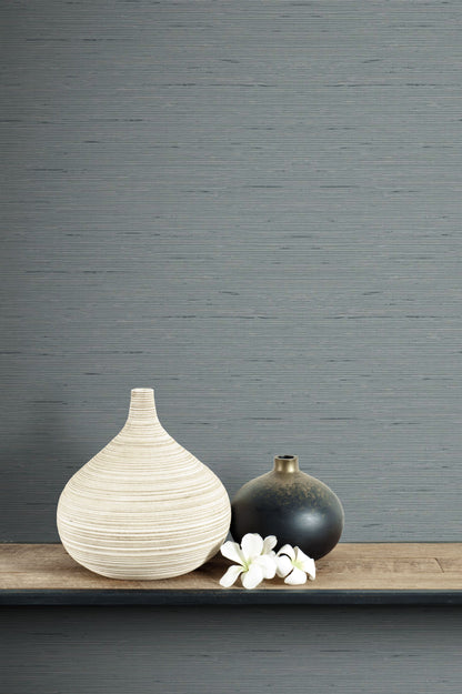 Two vases on a wooden surface with a wall decorated with Templeton Gray Natural Weave Commercial & Vinyl
 in the background.