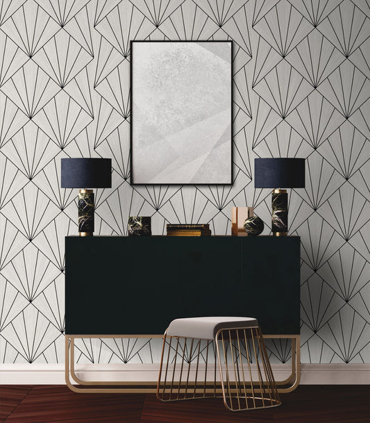 Modern interior design with wall Black & White Art Deco Geo Commercial & Vinyl, black console table, and lamps.