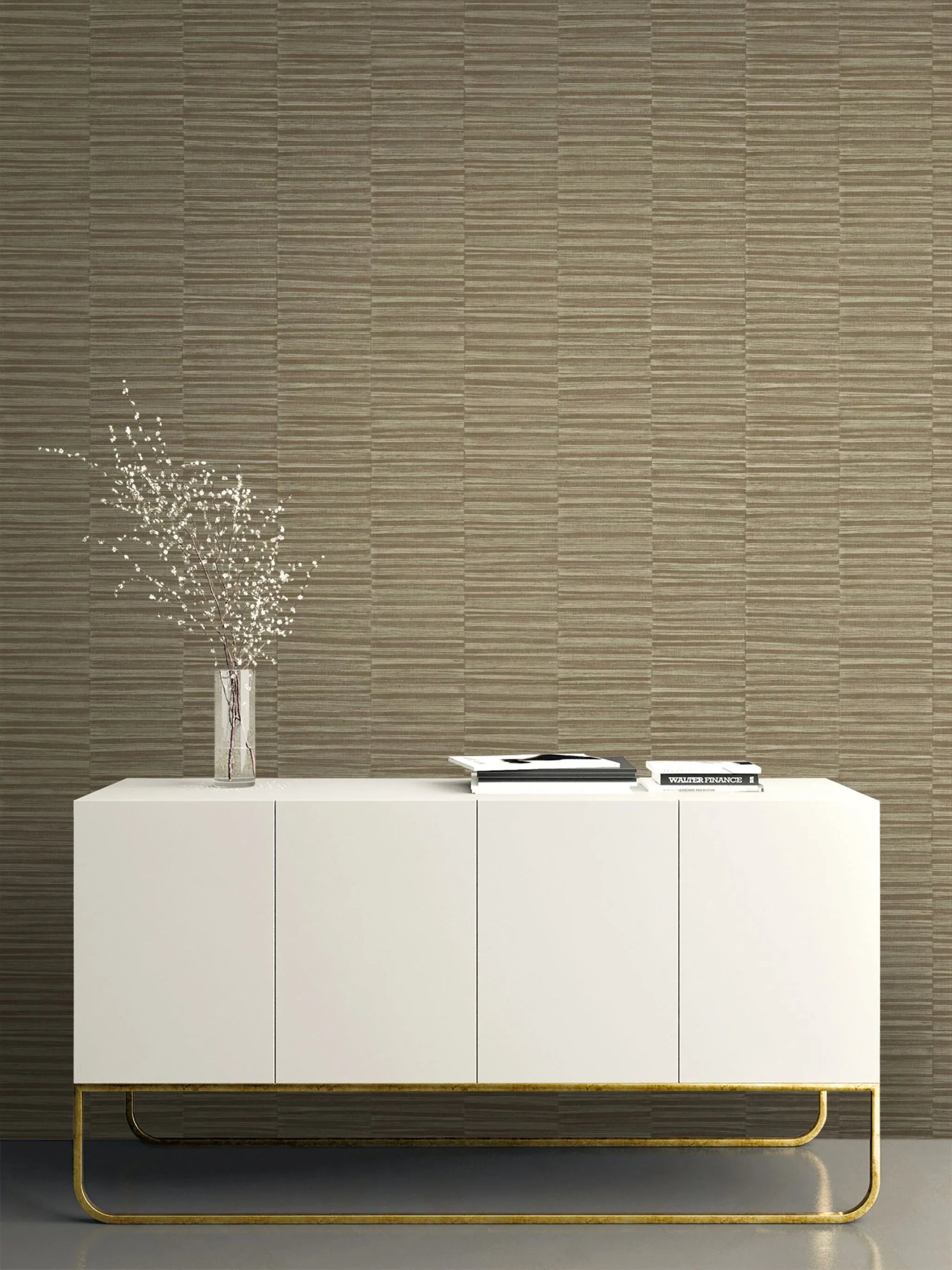 Minimalist white sideboard with gold legs, decor, and flowers against Industrial Grasscloth Stripe Commercial Vinyl.
