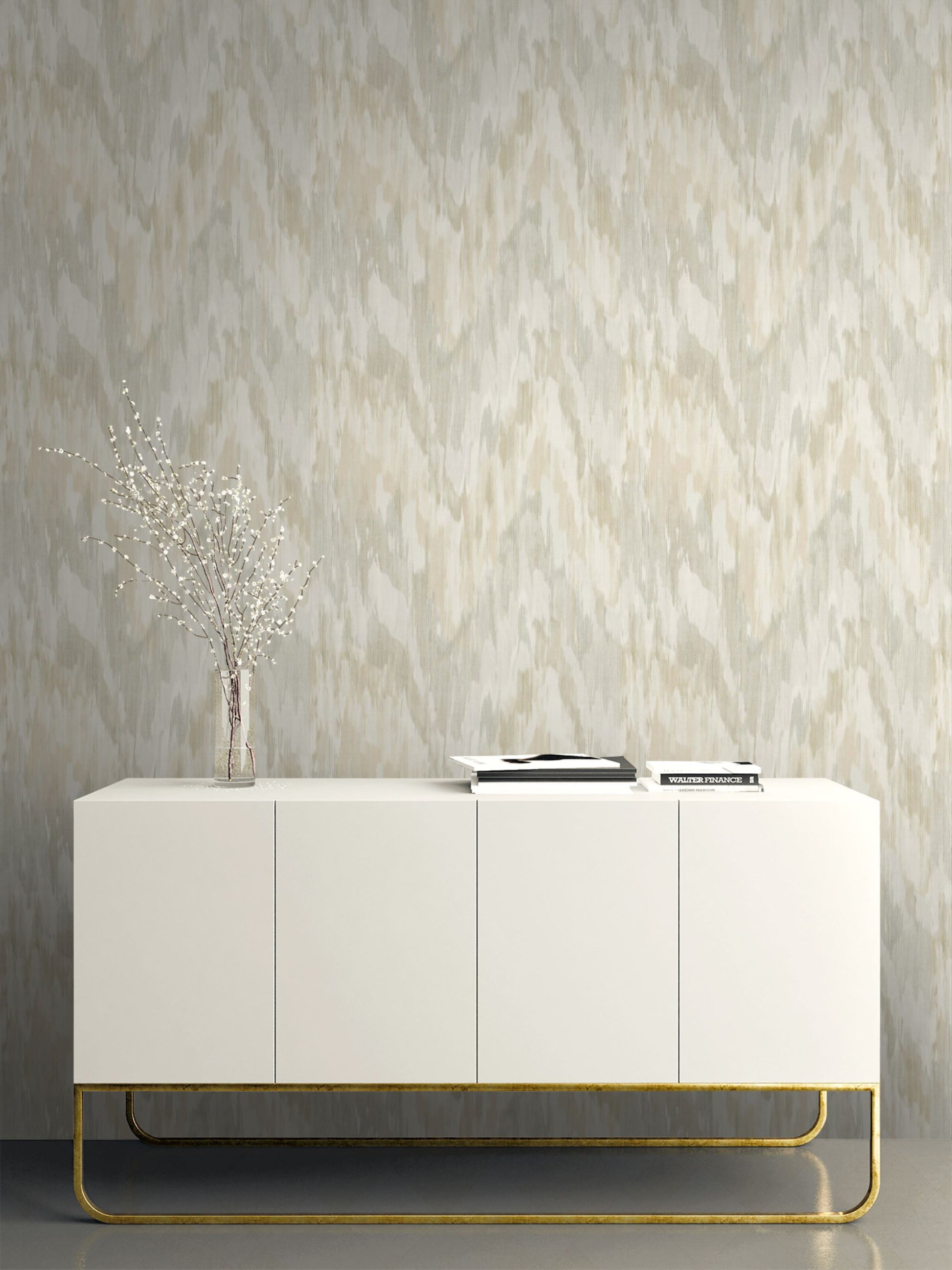 White sideboard with gold legs against a Beige & Green Watercolor Wave Wallpaper.
