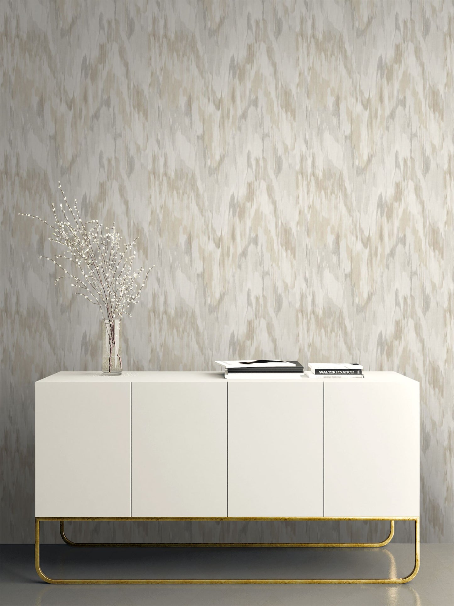 White sideboard with gold legs against a wall decorated with Beige & Gray Watercolor Wave Wallpaper.
