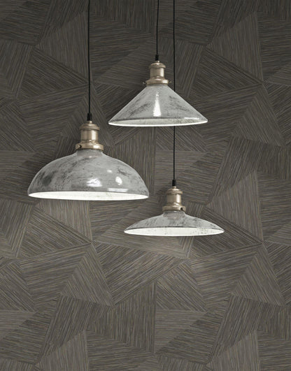 Three industrial-style pendant lights hanging against a wall decorated with Brown & Taupe Geometric Fibers Triangles Commercial & Vinyl.