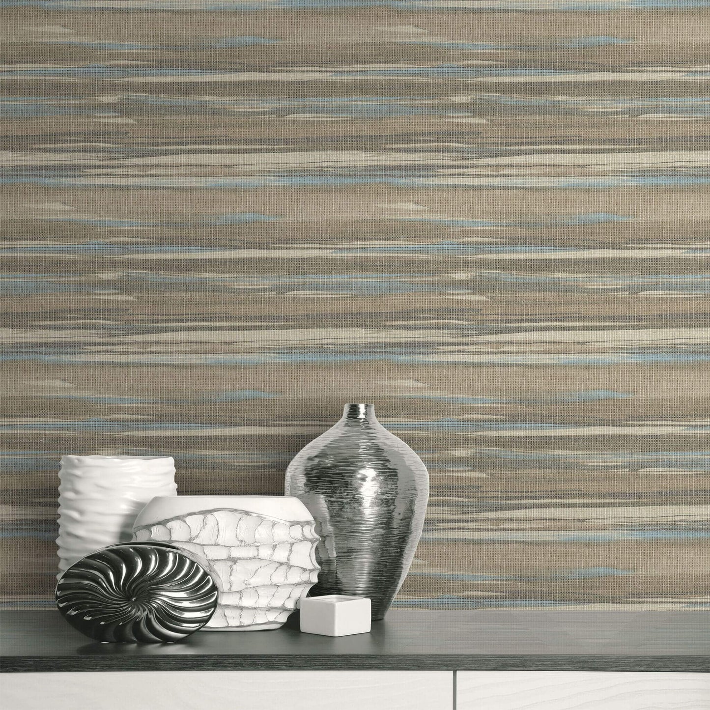 Decorative vases against a patterned Brown & Bleu Grasscloth Waves Wallpaper.