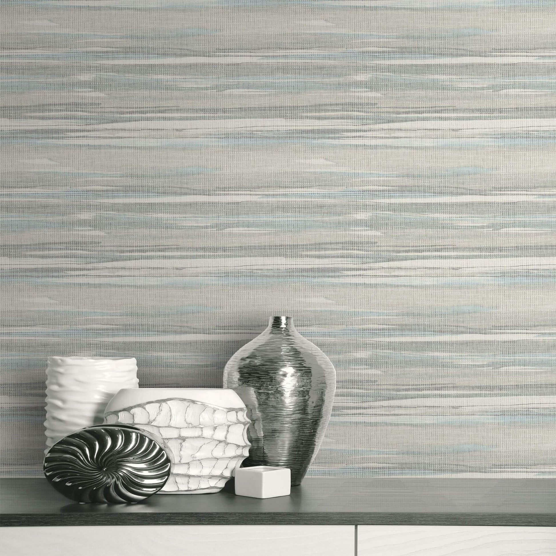 Decorative vases against a textured  Soft Gray & Sky Bleu Grasscloth Waves Wallpaper.
